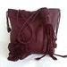 Burgundy leather handbag tote with fringe, flower and leaves by Tuscada. Ready to ship.