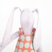 Plush Minimalist bright lilac rabbit wearing pastel peach dress with mint polka dots, timo handmade fabric doll