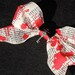 DEXTER-ribbon hair clip with a bow button and skull key.