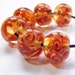 Handmade lampwork glass bead twiddly twirlies set of 6 orange lampwork beads