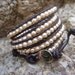 Chan Luu style freshwater pearl wrap bracelet on brown leather.