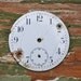 Antique pocket watch face.