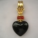 SALE Vtg Joan Rivers Black Glass Heart Pendant/Slide on Gold hanger with Orangy Topaz faceted Glass Bead and Gold Bail