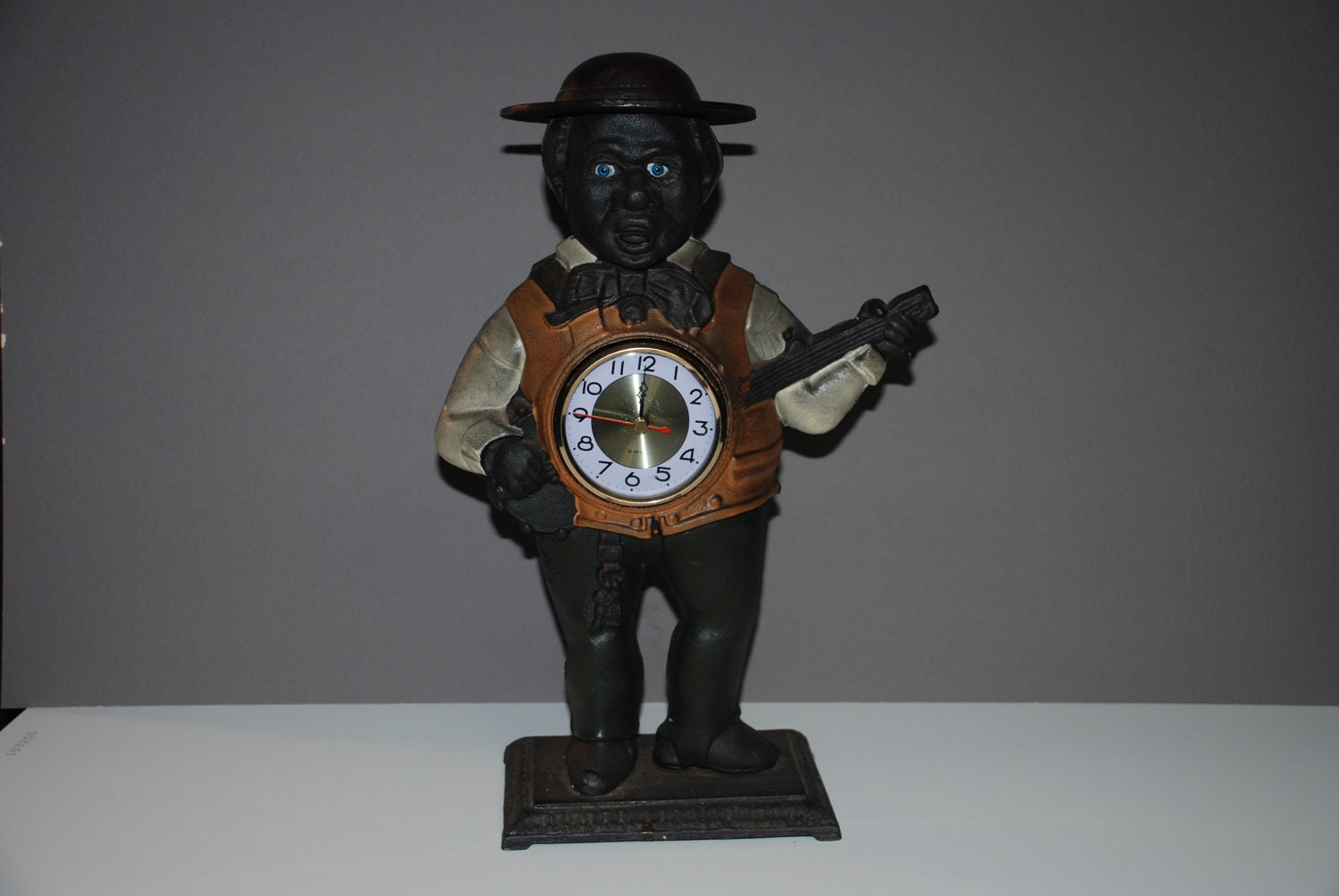 Cast Iron negro minstrel banjo clock
