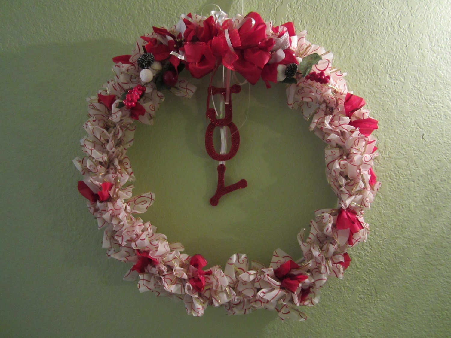 Red and White Ribbon Christmas Wreath with wooden "JOY"
