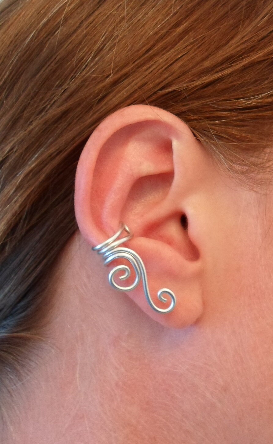 Double Spiral Ear cuff in wire wrapped aluminium. wire by alufolie