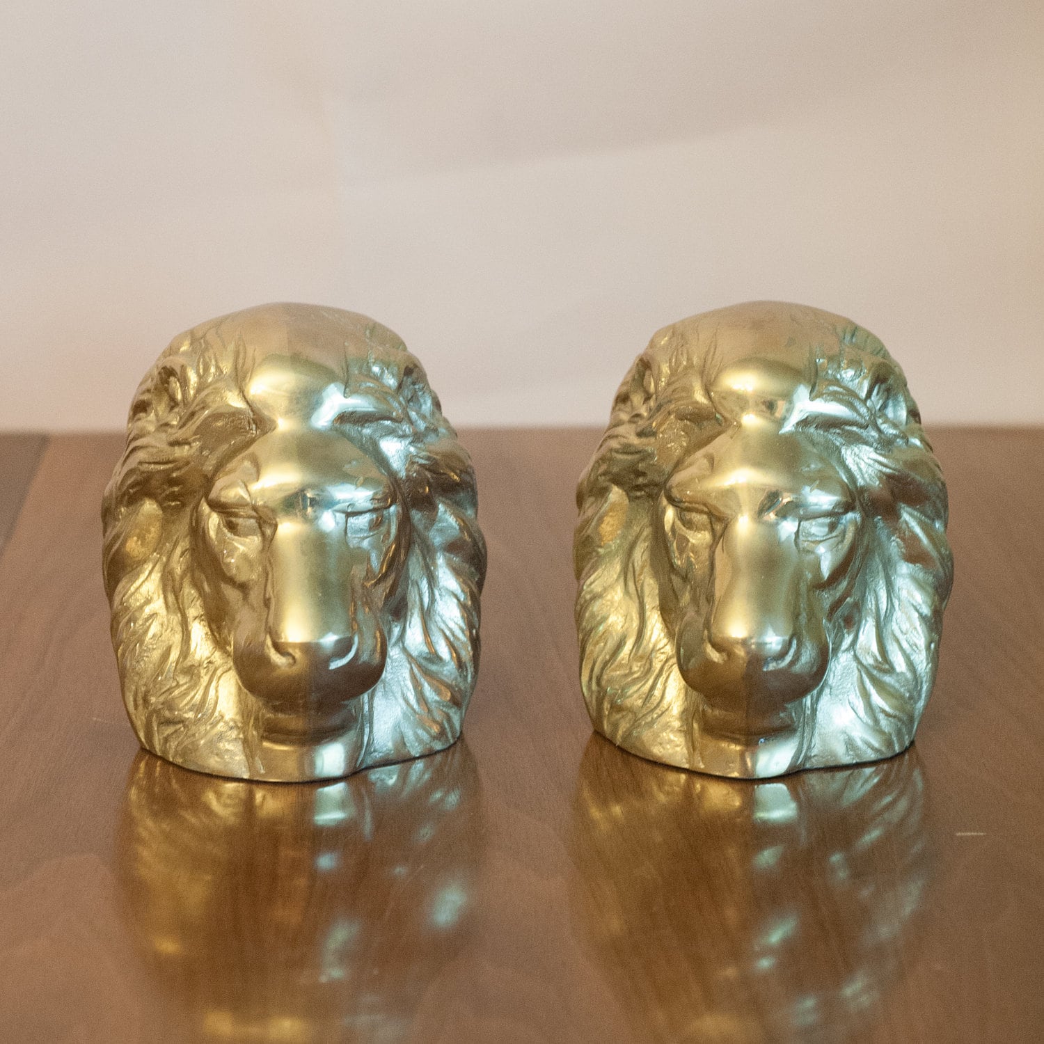 Vintage pair of solid brass lion head bookends Hollywood