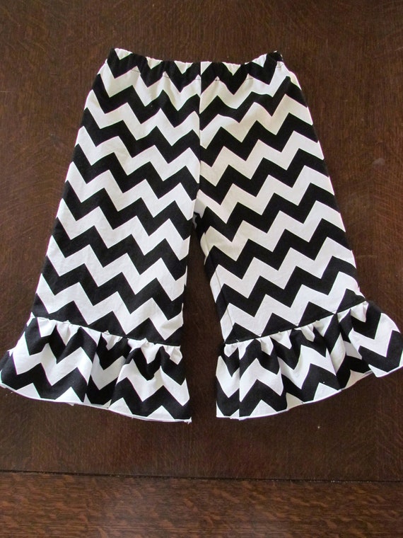 Items similar to Girls ruffle pants black chevron pants or capris in
