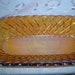 Carnival glass reilsh dish Orange with rainbow of colors effect