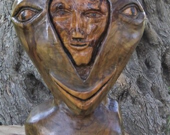 Split personality. Olive wood Sculpture