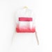scarlet red backpack with coral pink pouch