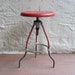 vintage c. 1930s red industrial shop stool with revolving adjustable seat