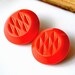 Vintage chunky red orange gold luster glass buttons X 2