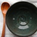 Blue baby food bowl with double ridge detail and wooden spoon