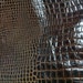 A cutting of a unique Reptile RICH brown bordeaux thin cow hide - a 1 square foot hide