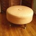 Mid-century inspired Round Ottoman with Knoll Fabric