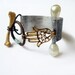 The Guiding Hand. Hamsa with pearl pin bone toggle and etched cuff.