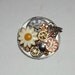 Daisy steampunk brooch with copper flowers watchparts gears and watch dial