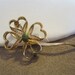 Delicate goldtone filigree shamrock 4 leaf clover pin with jade bead