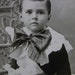 Cute Boy with Period Clothing - Cabinet Photo - Ruffled Shirt and Big Bow - Wicker Chair
