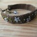 Fiber Bracelet Embroidered with Blue Flowers on Brown Linen