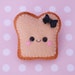 Toast Felt Brooch with Black Bow