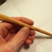 Hand carved hair stick shawl pin in curly cherry wood