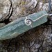 Natural green kyanite and sterling silver necklace. Handmade. Rough stone. Mineral properties.