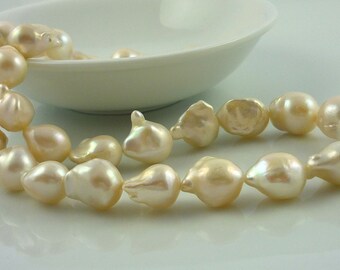 SALE......Creamy White Nucleated Flameball Pearls 13-15mm full strand