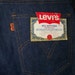 Vintage orange tag 1970s bellbottom Levi's n 32 Waist 30 length Deadstock with tags Denim