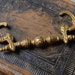 Antique brass drawer pull handle.