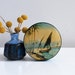 Vintage blue toffee tin box, nautical scene with sail boat and palm trees