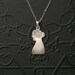 Victorian Folk Art Charm Necklace. Bust in Profile. Woman with Bun.
