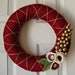 Red and gold yarn wrapped holiday wreath
