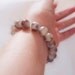 Brown and white paisley bracelet, stretchy cord type