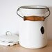 Vintage white enamel milk can
