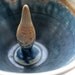 Hand thrown small ornamental bowl with blues and browns