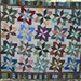 Beautiful batik throw with hand dyed fabrics quilted with an all over stipple