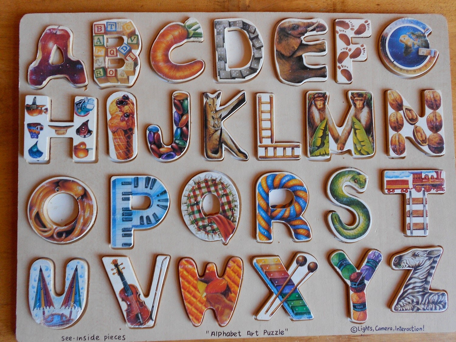wooden alphabet puzzle with words to spell