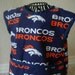 Broncos Art Smock or Apron with a Dark Blue Trim. Size 3t-4t.