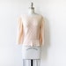 1970s peplum sweater / vintage 70s peach pointelle knit sweater