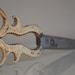Vintage / Antique Beige Curved Metal Scissors.
