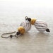 Golden Twirl Hollow Glass Earrings
