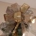 Lg Xmas Tree topper bow made of both gold and silver lame' ribbon, a sheer ribbon with gold and silver zebra stripes