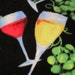 Wine Glasses and Grapes on Black with Red Fleece Blanket