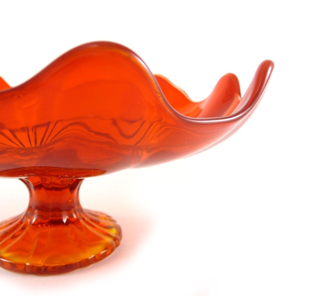 Bright orange glass pedestal candy dish