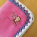 Adorable pink fleece blanket with embroidered monkey and crocheted edge, 32 x 42