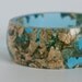 blue resin round bangle made with eco resin containing metallic gold leaf foil