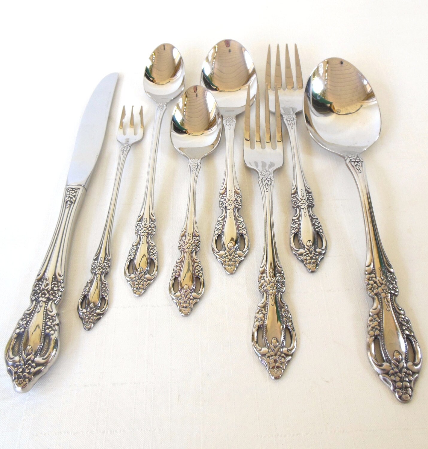 Oneida Monte Carlo Stainless Steel Flatware Set - USA Made, Glossy Finish, Pierced Floral Handle - U Select