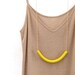 not quite a semi circle makes a necklace
